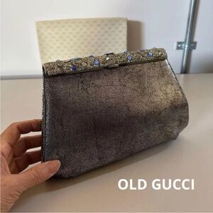 Gucci Metallic Silver Clutch with Blue Accents